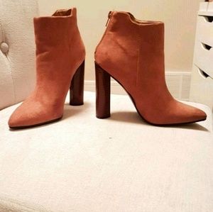 Tan heeled ankle boots in a size 6